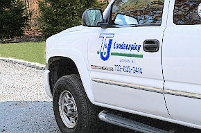 Image of T&J Landscaping logo on truck door