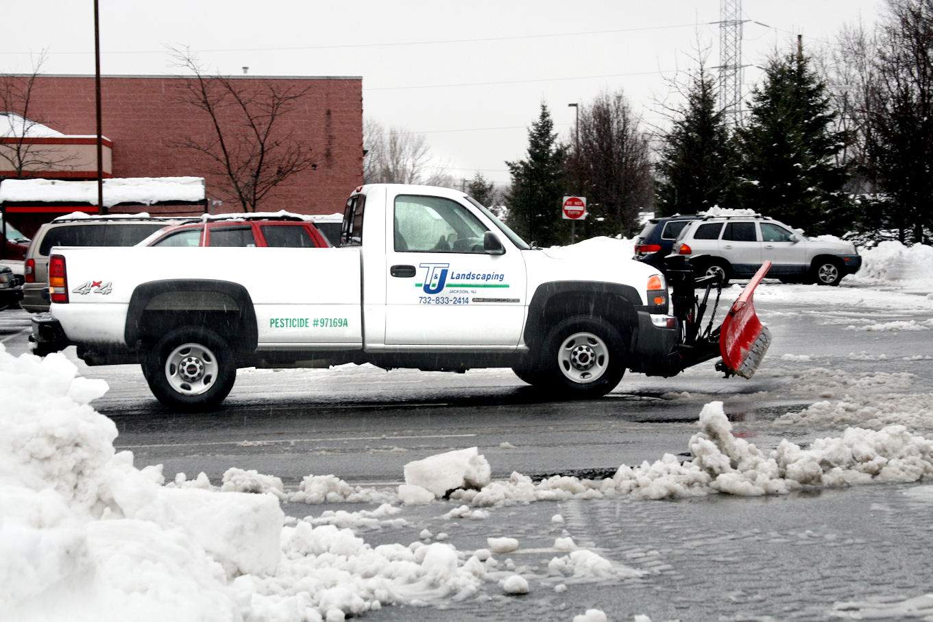 Plow truck with plow blade is blizzard ready